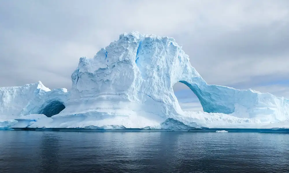 Iceberg tunnel-Antarctica - GlobalXplorers